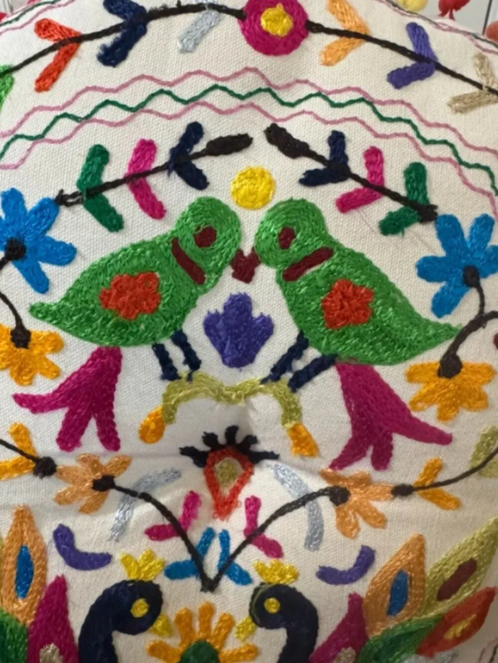 Embroidered round decorative pillow